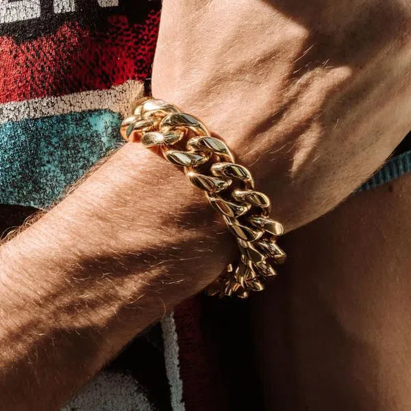 Gold Cuban link chain bracelet showcasing a stylish masculine aesthetic.
