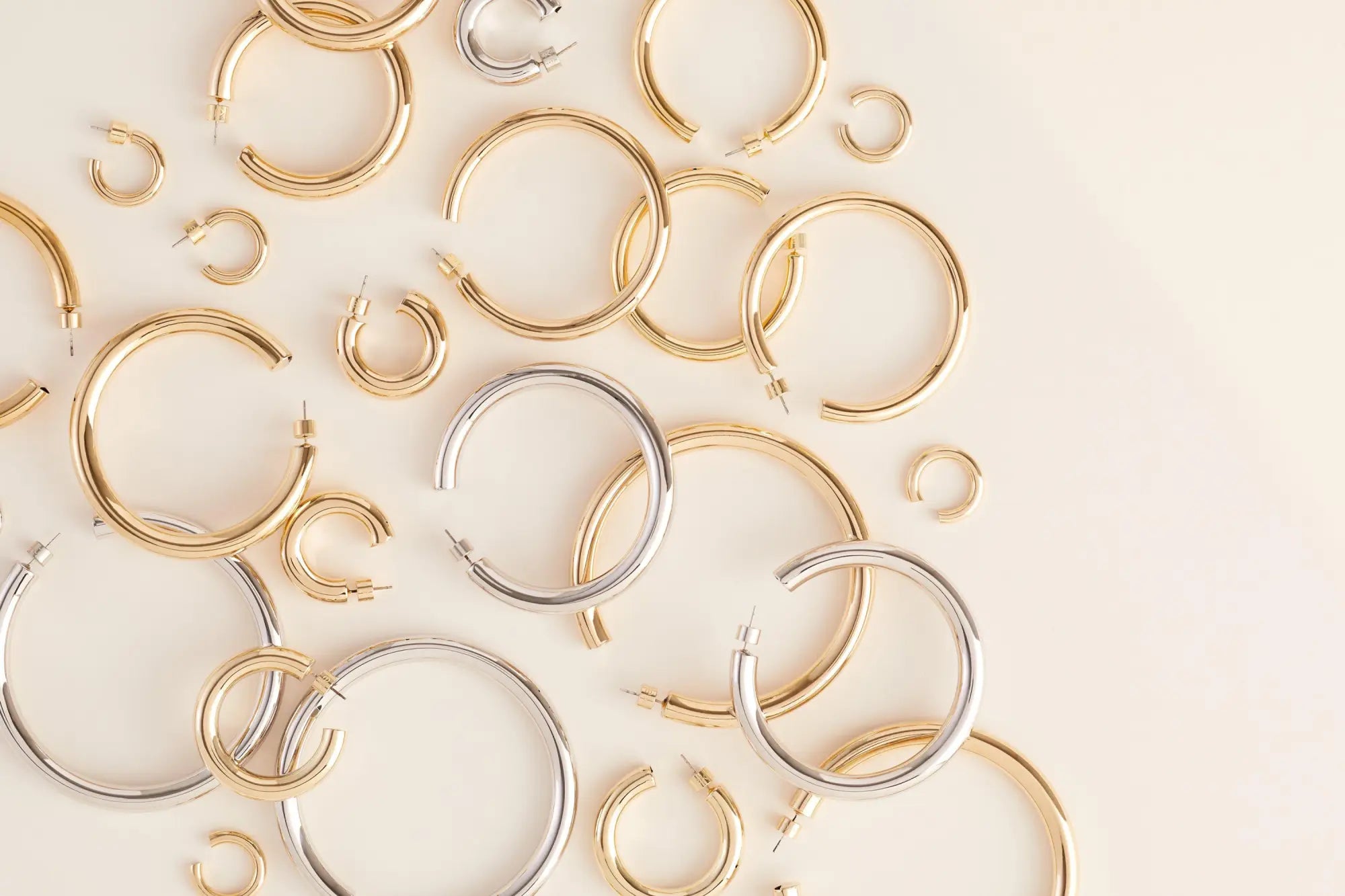 Assortment of gold and silver hoop earrings in the Hoop Earrings collection