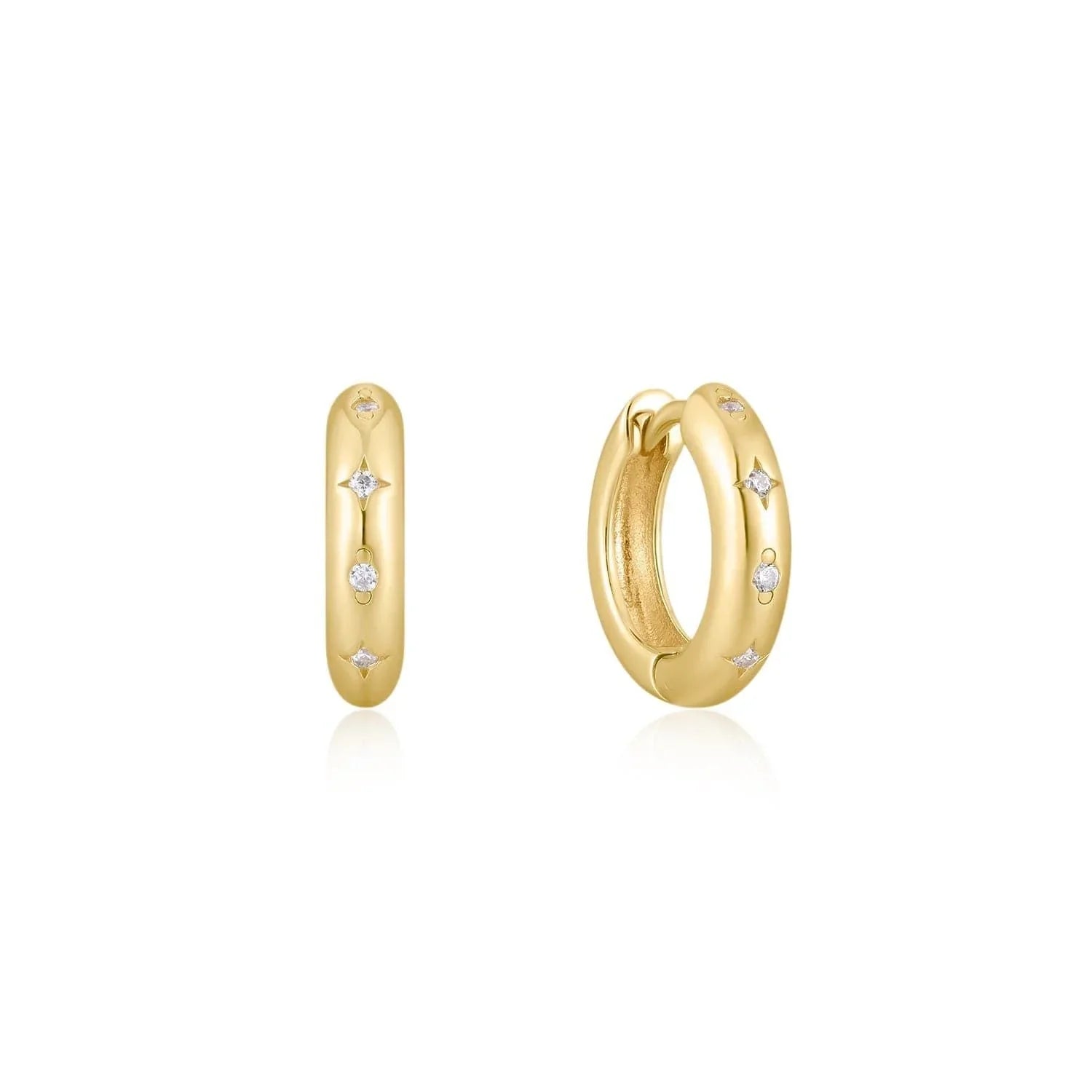 Gold hoop earrings with embedded gems from 8.5mm CZ Galaxy Huggie Hoops collection