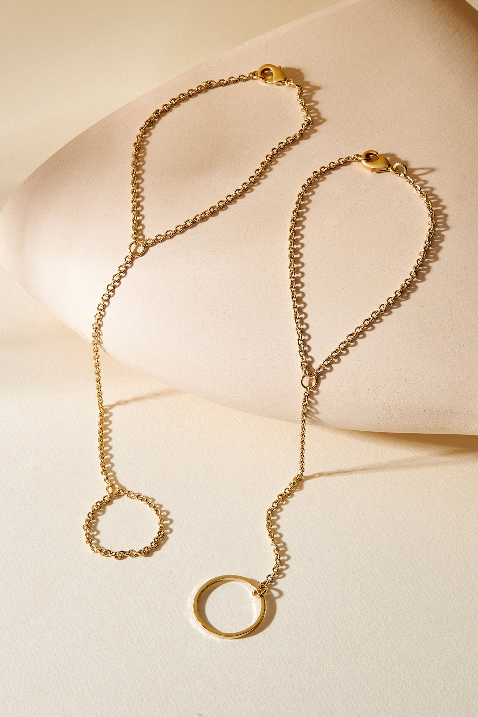Two gold hand chain bracelets from Law Hand Chain for a stylish look