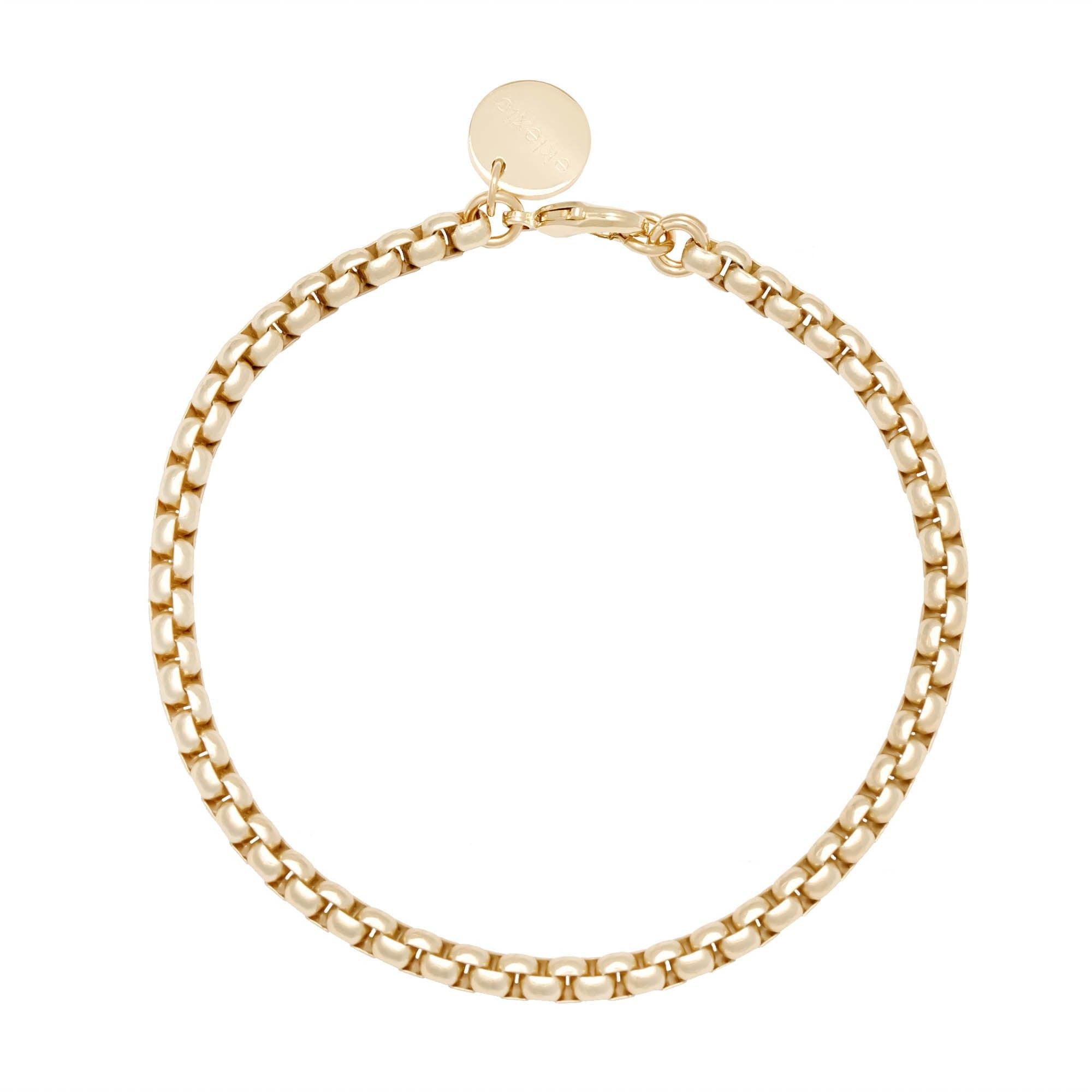 Gold-toned Luciana Box Chain Bracelet with round charm on display