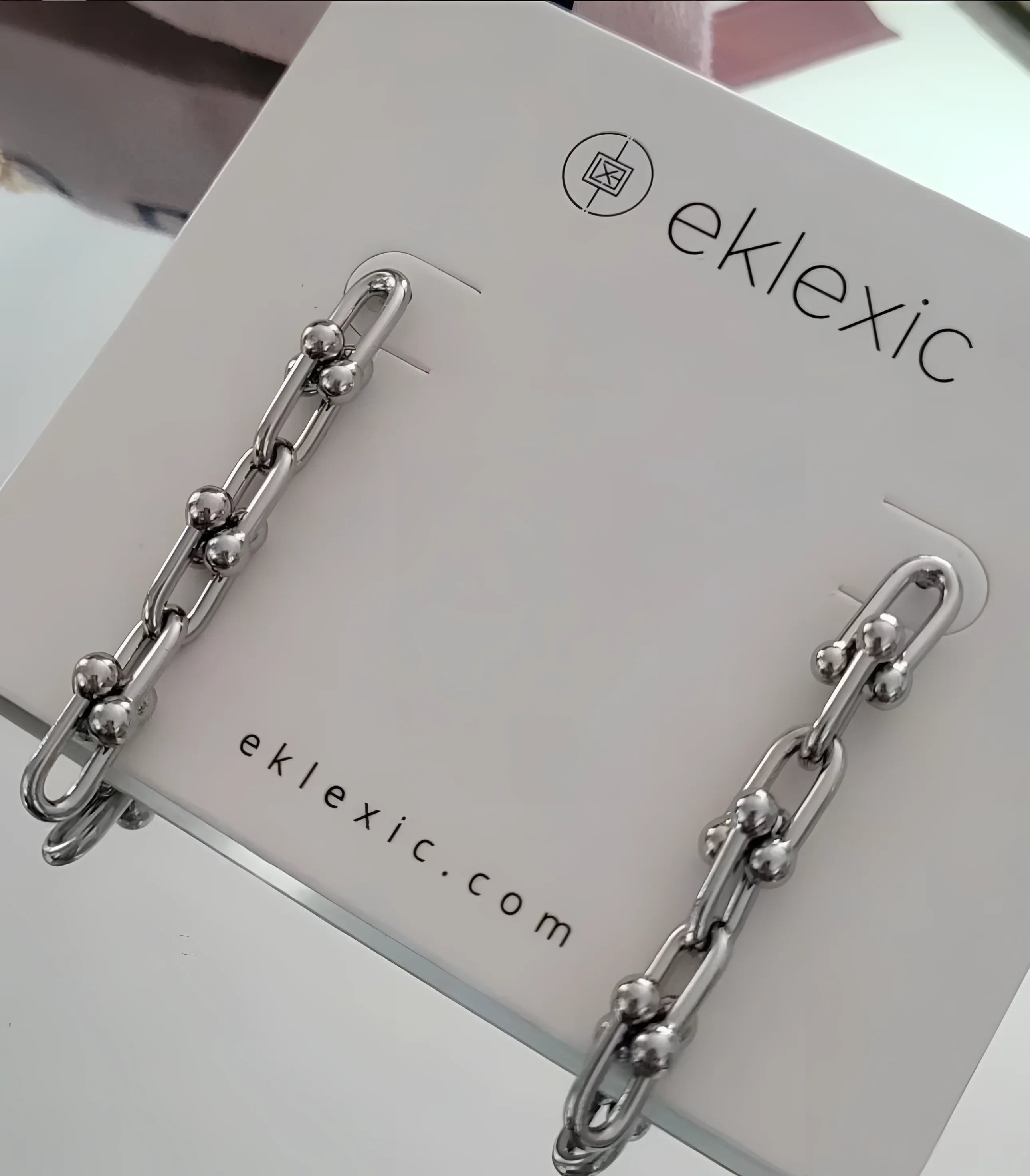 Silver chain-link earrings from Margaux 4 Link Drop Earrings collection