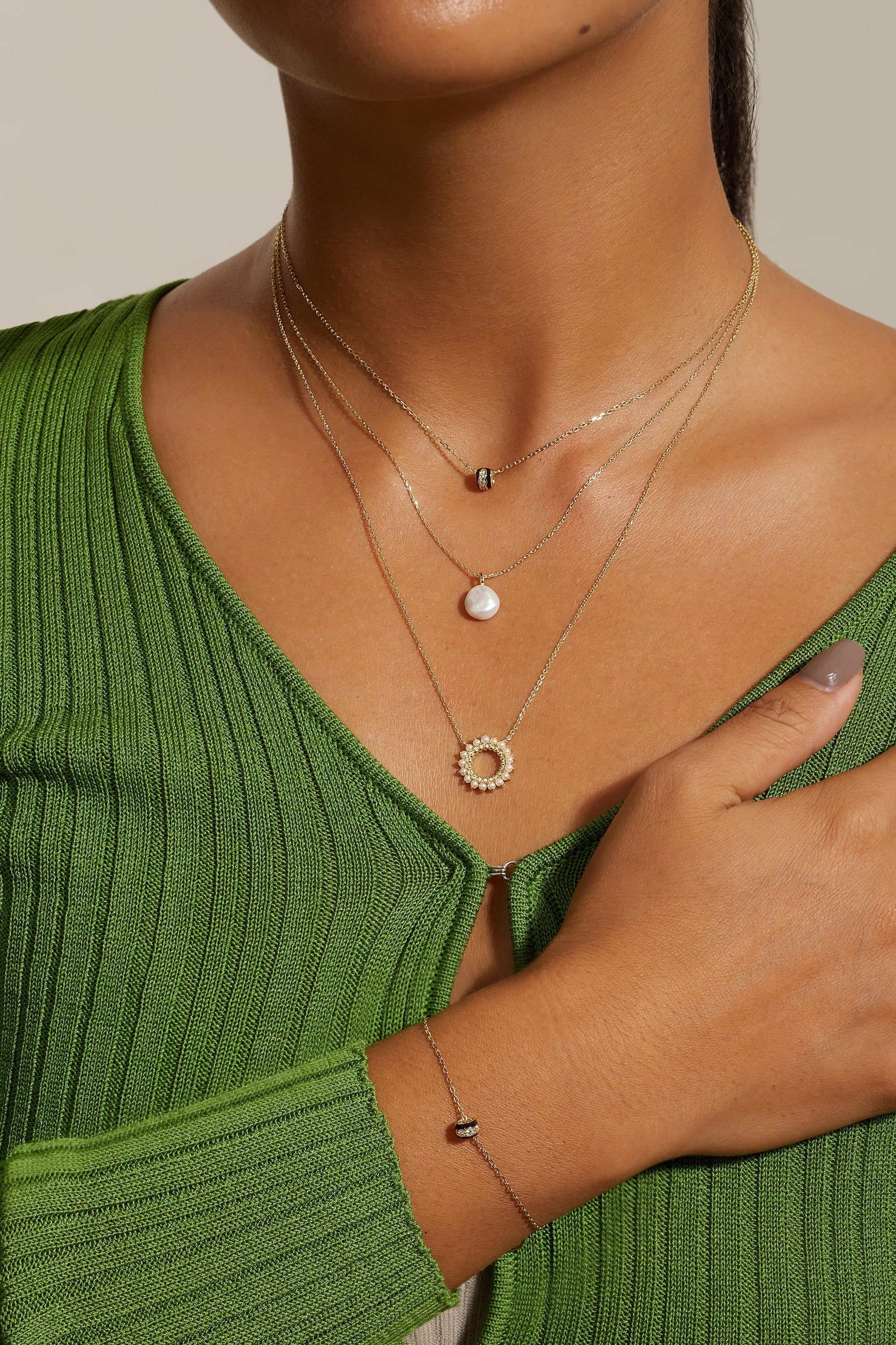 Layered gold necklaces with matching bracelet featuring Open Center Multi Pearl Pendant