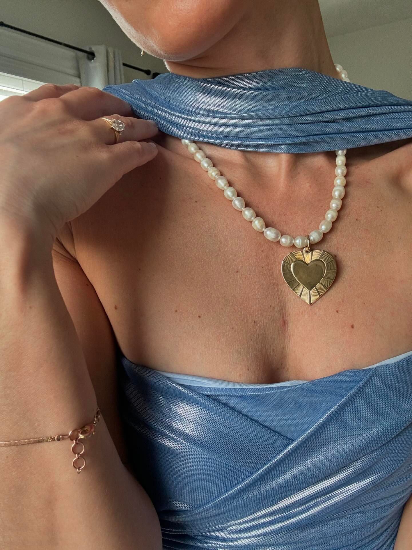 Pearl & Hildegard Pendant Necklace with a cute heart-shaped pendant and shiny pearls