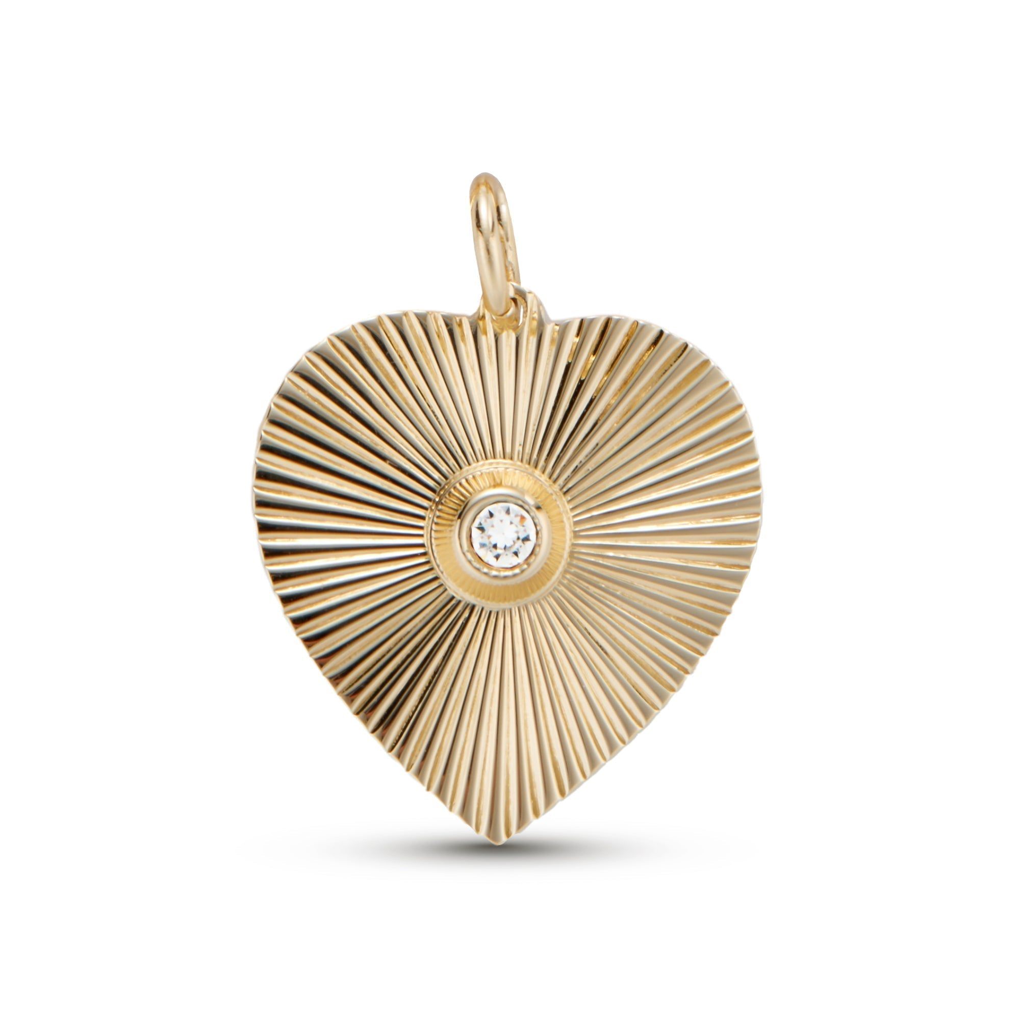 Gold heart pendant with a sparkling central diamond from Perla Heart Pendant collection