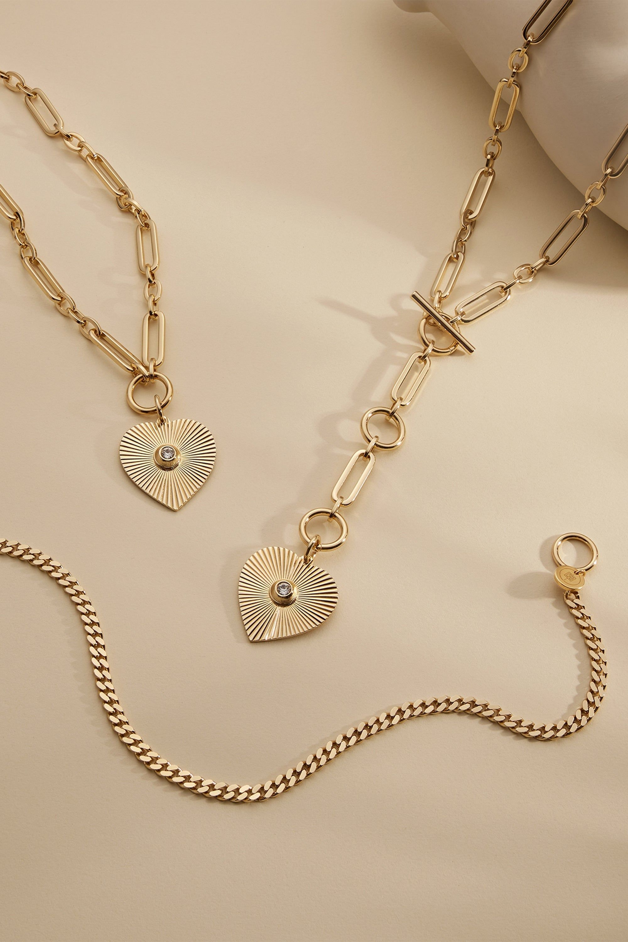 Gold-toned jewelry set with heart pendants, perfect for the Perla Necklace collection