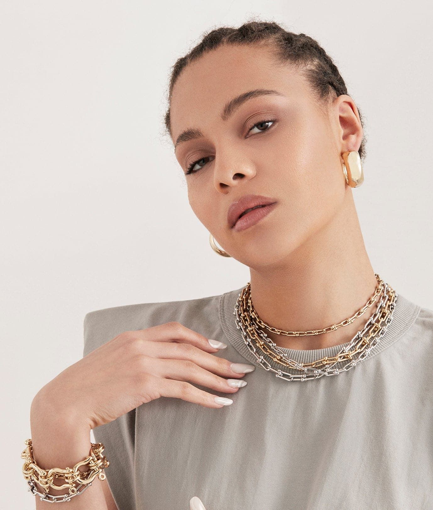 Woman wearing Gold Jewelry featuring the Small Margaux Necklace for a stylish look