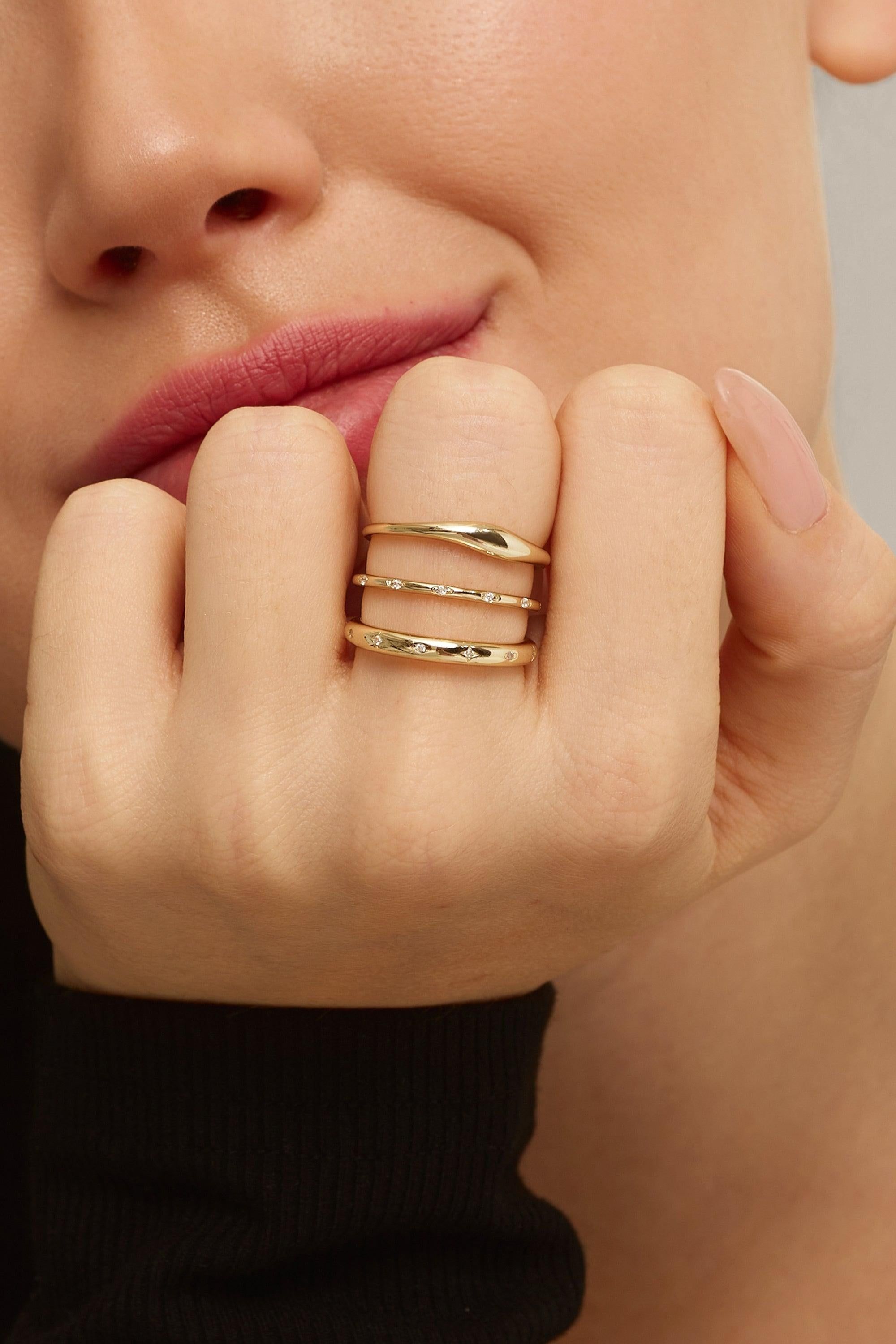 Gold stackable rings from the Tapered Wavy Ring collection showing stylish design