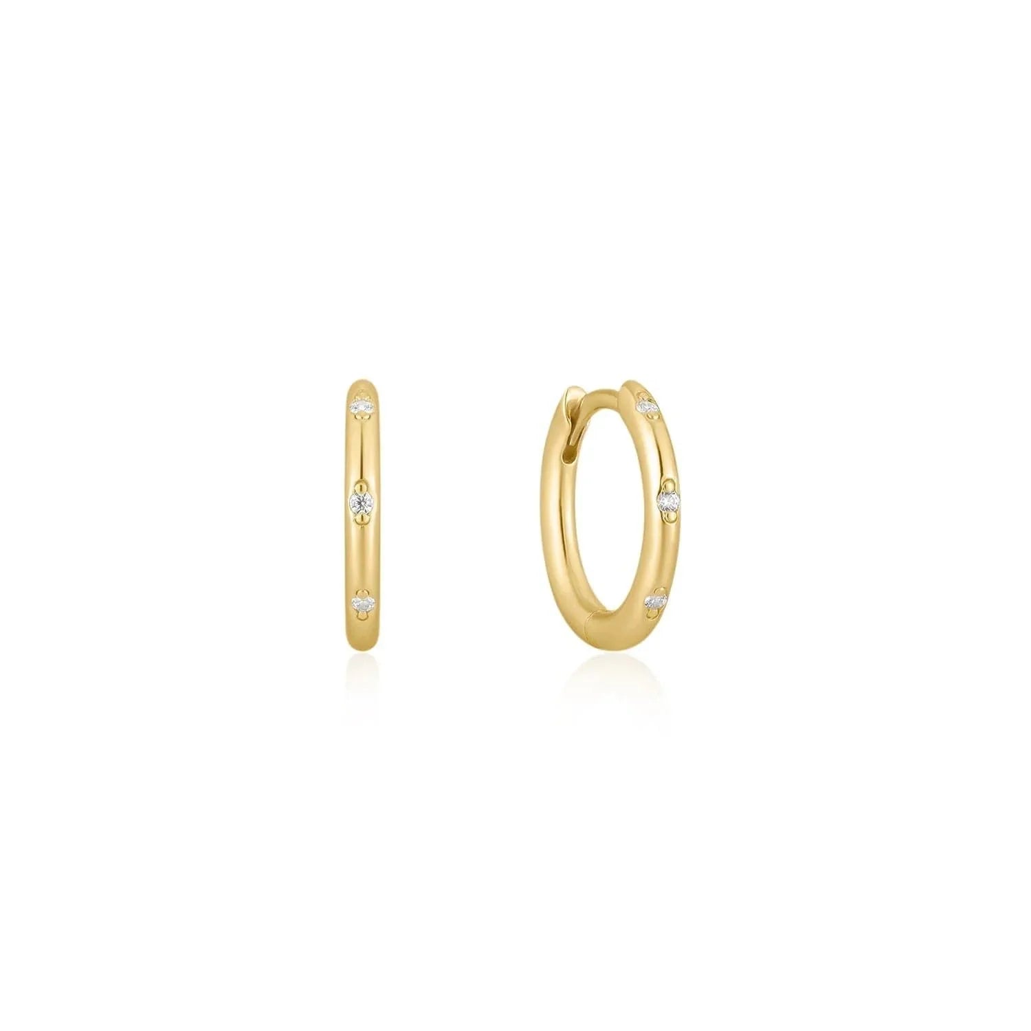 Gold hoop earrings with embedded gems from Thin CZ Studded Huggie Hoops collection