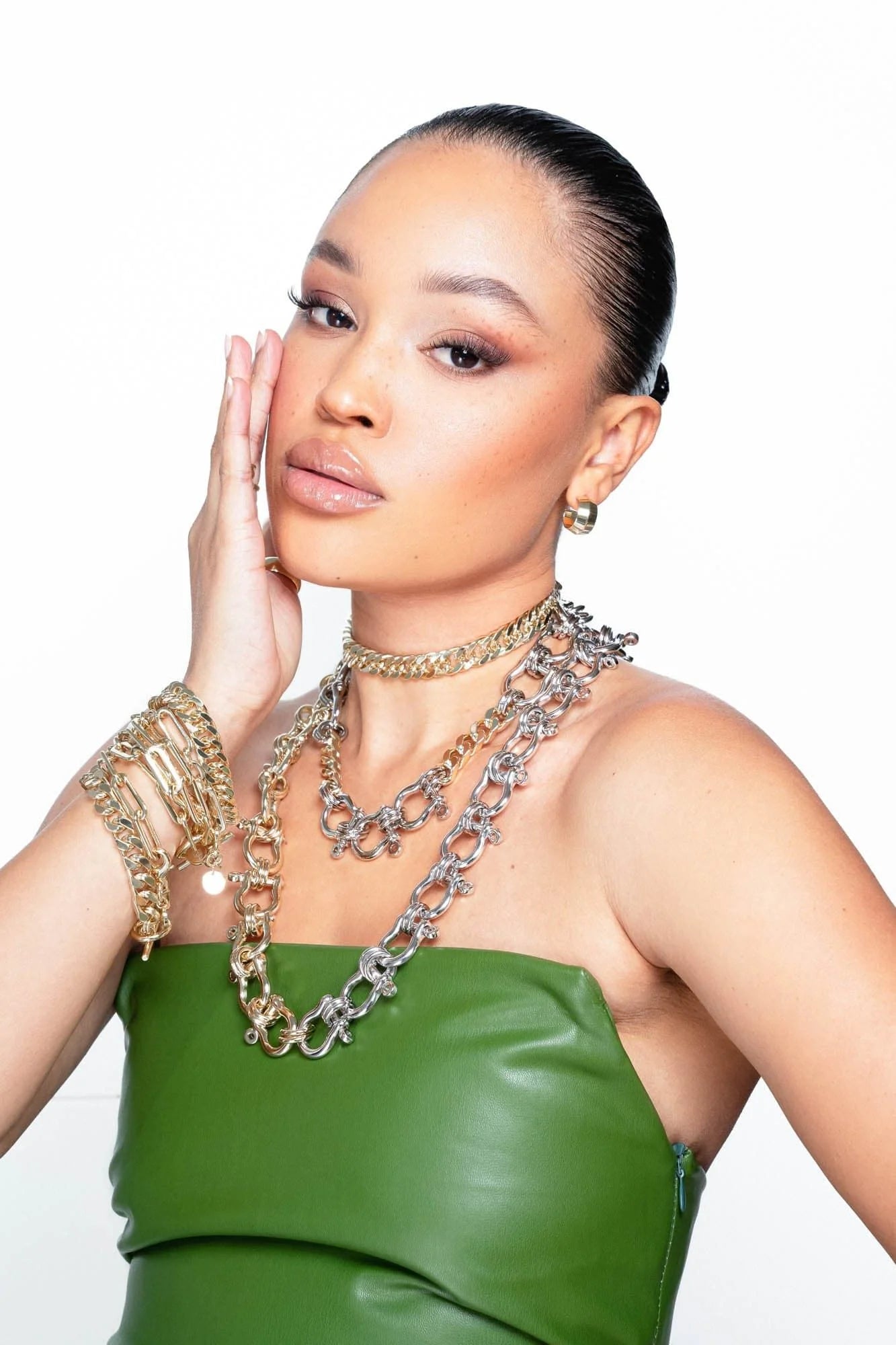 Woman wearing Arya Necklace with gold and silver slinky curb chain from layering necklace collection