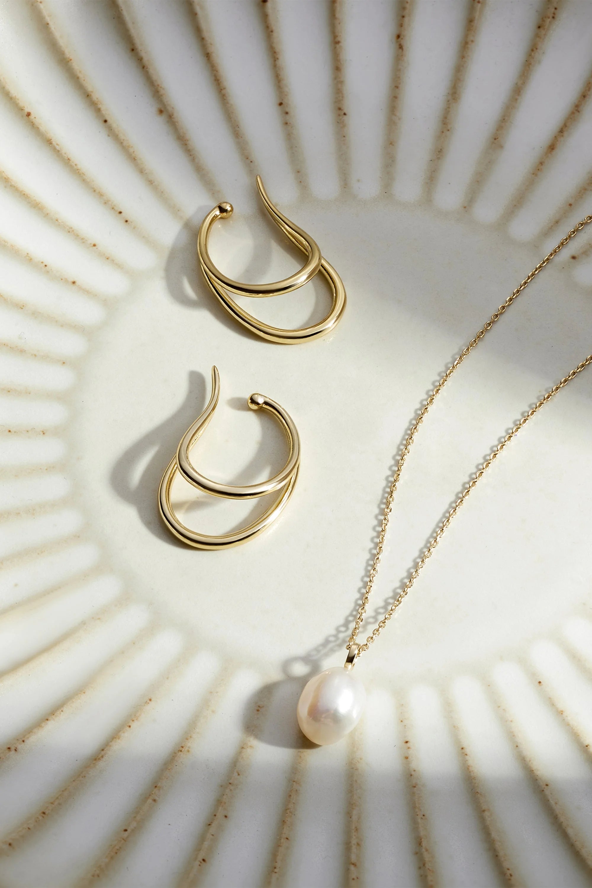 Large dual ear cuff featuring gold jewelry set with sterling silver and 14k gold accents