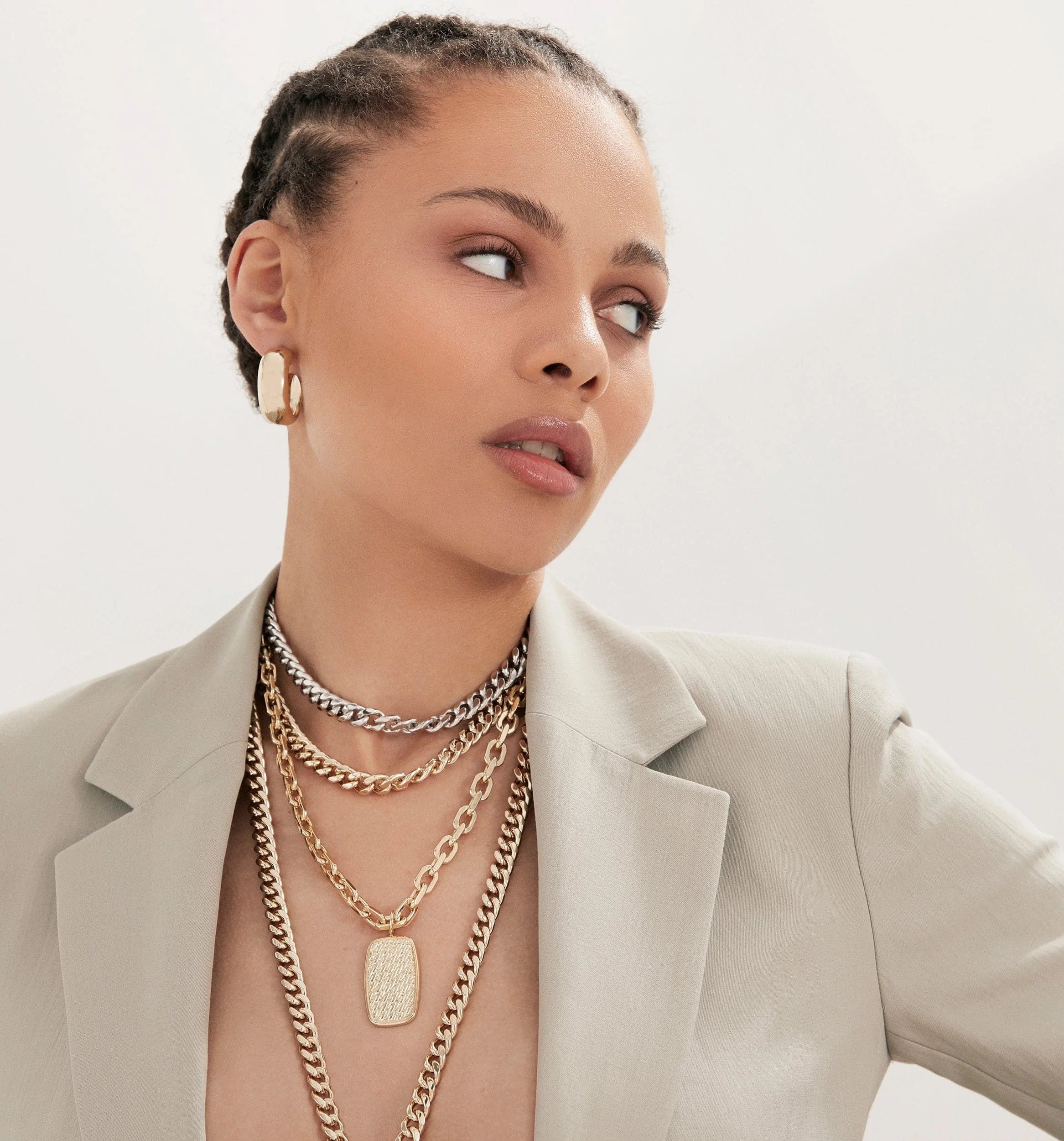 Woman wearing layered two-toned double curb chain necklace with 15mm curb chain design