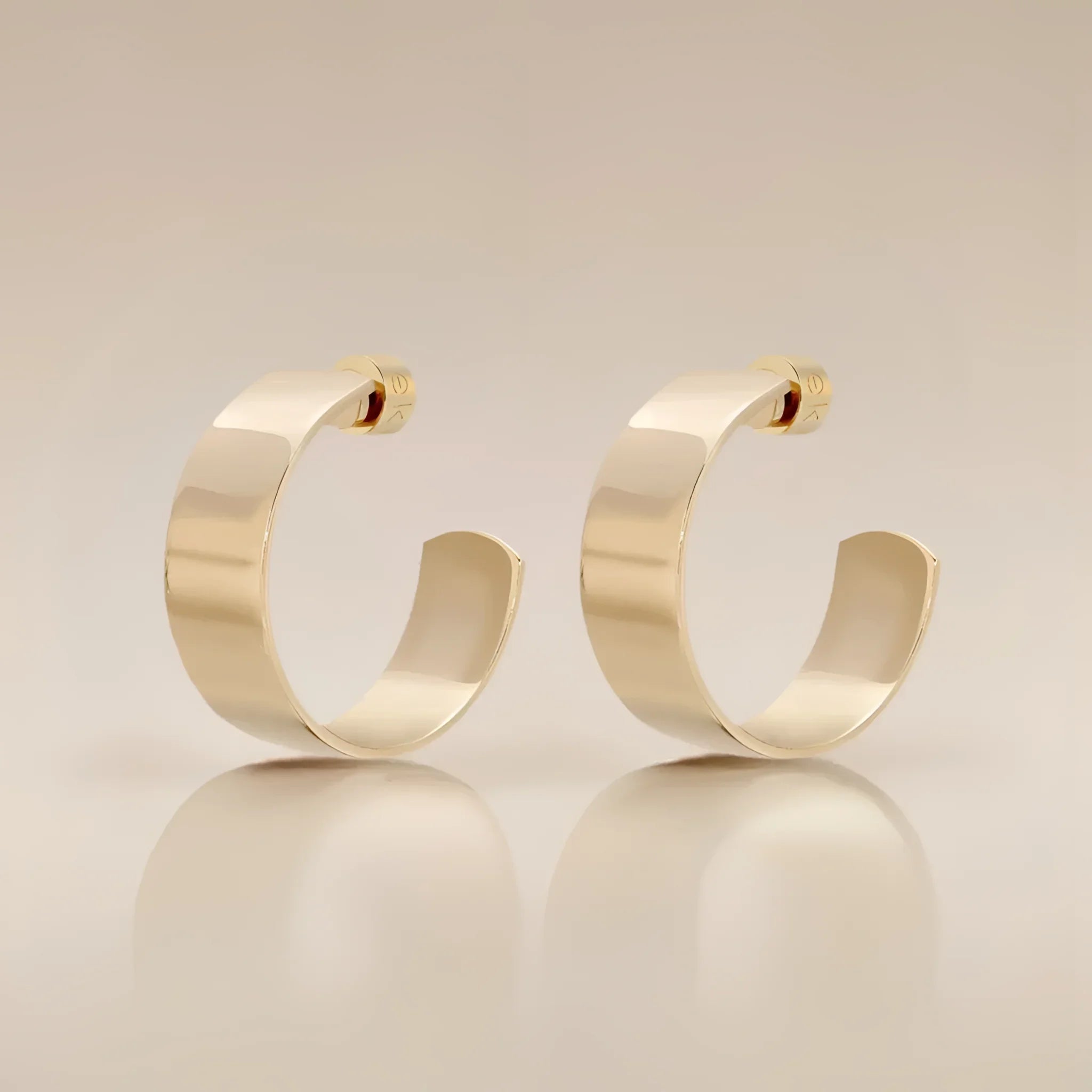 Pair of gold hoop earrings from the 1 Skylar Hoops collection