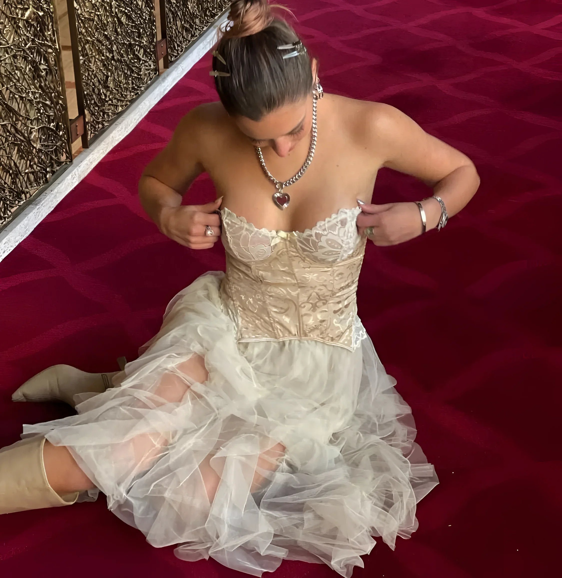 Woman in corset dress wearing Curb Chain & Heart Pendant Necklace for a chic look