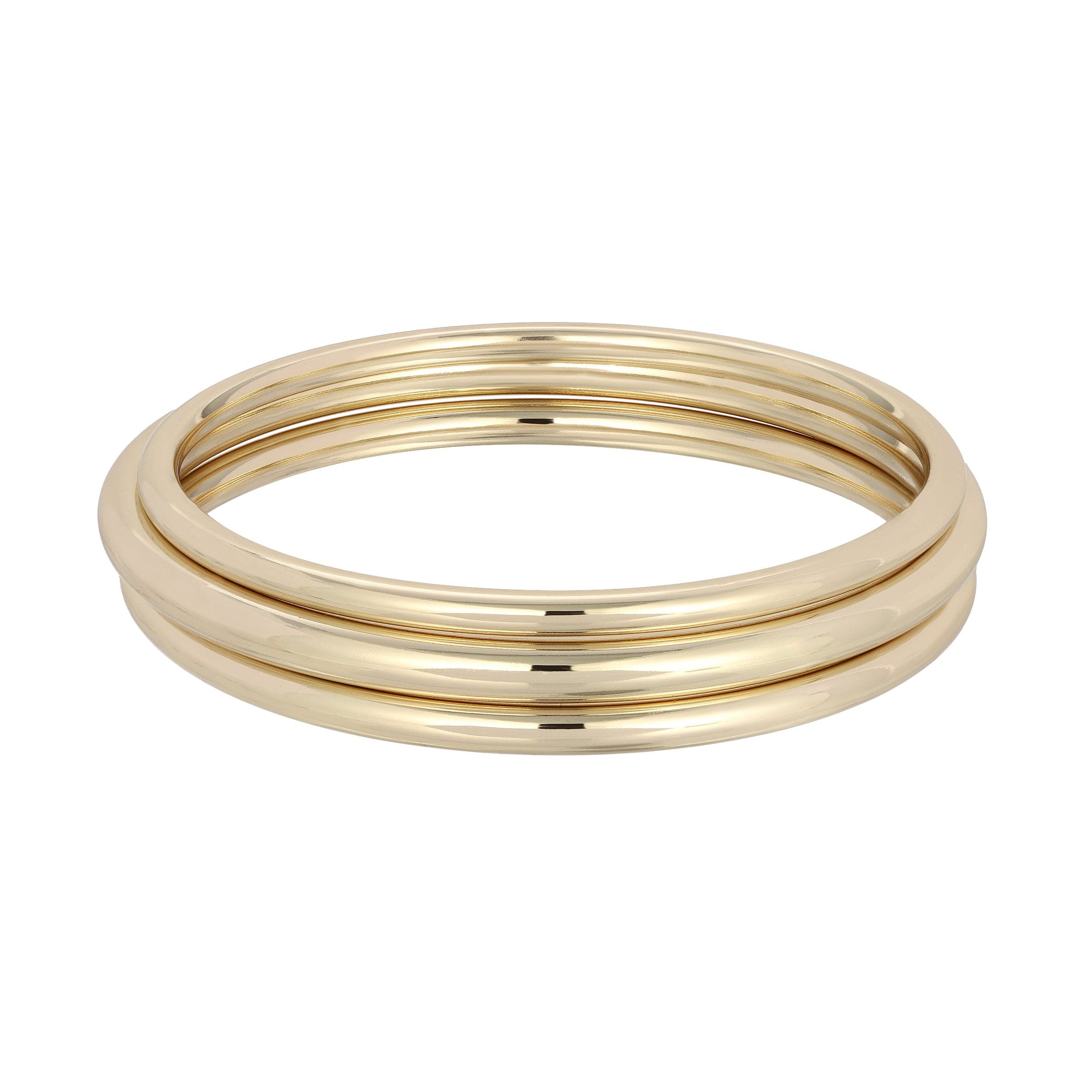 Gold bangles from the Classic Bangle Set showcasing elegant jewelry style