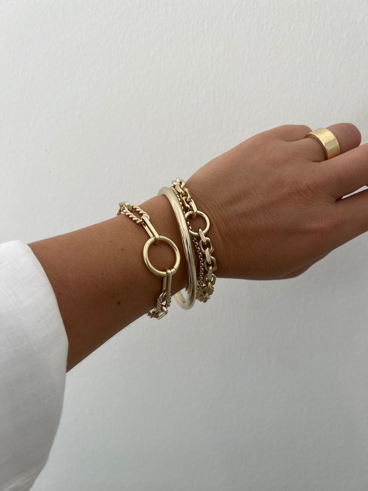 Gold-toned bracelets and ring from Eliza Bracelet collection for a chic look