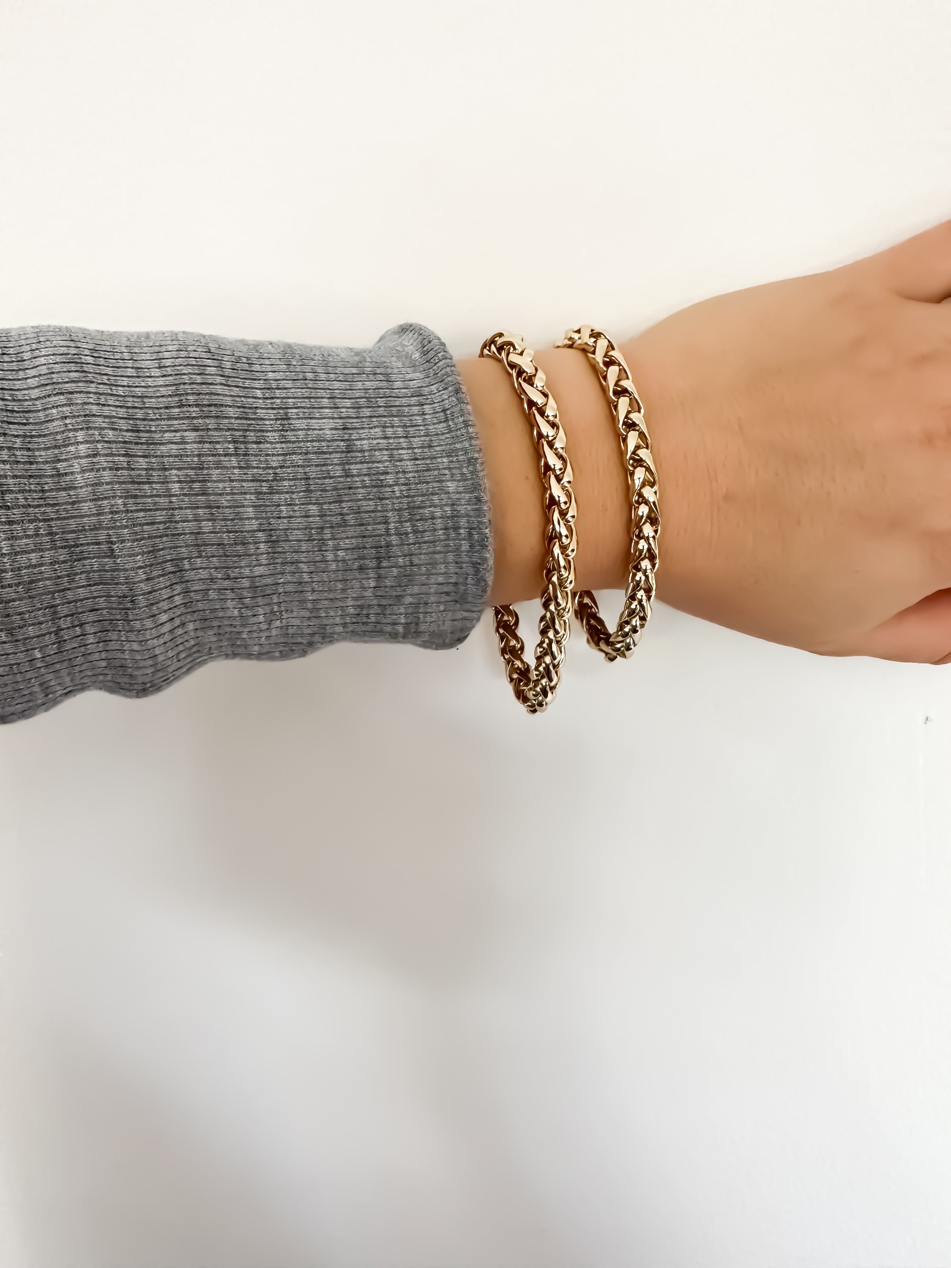 Esmé Bracelet featuring two stylish gold braided bracelets for a chic look