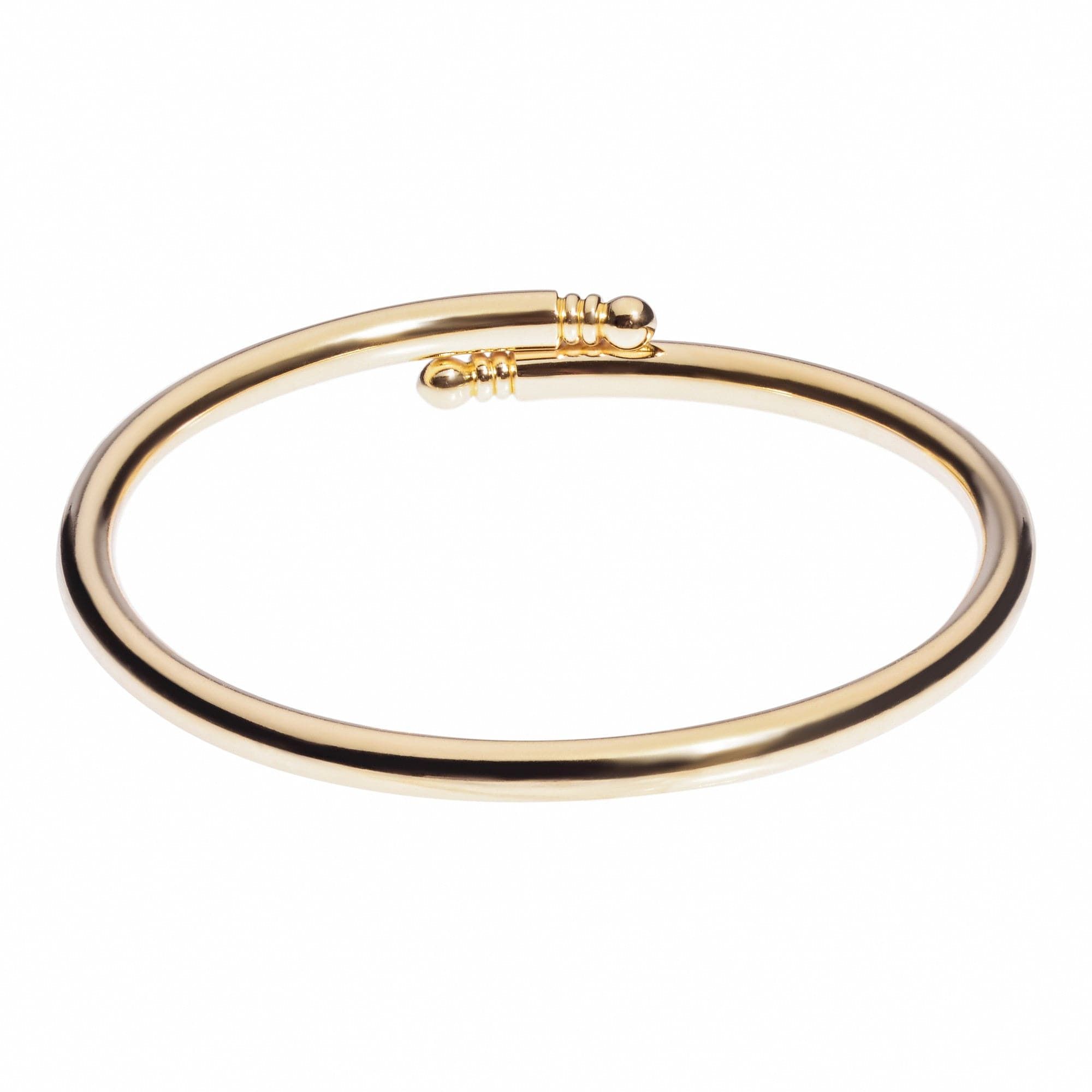 Gold-colored open-ended bangle from Knob Ended Bangle collection perfect for stacking