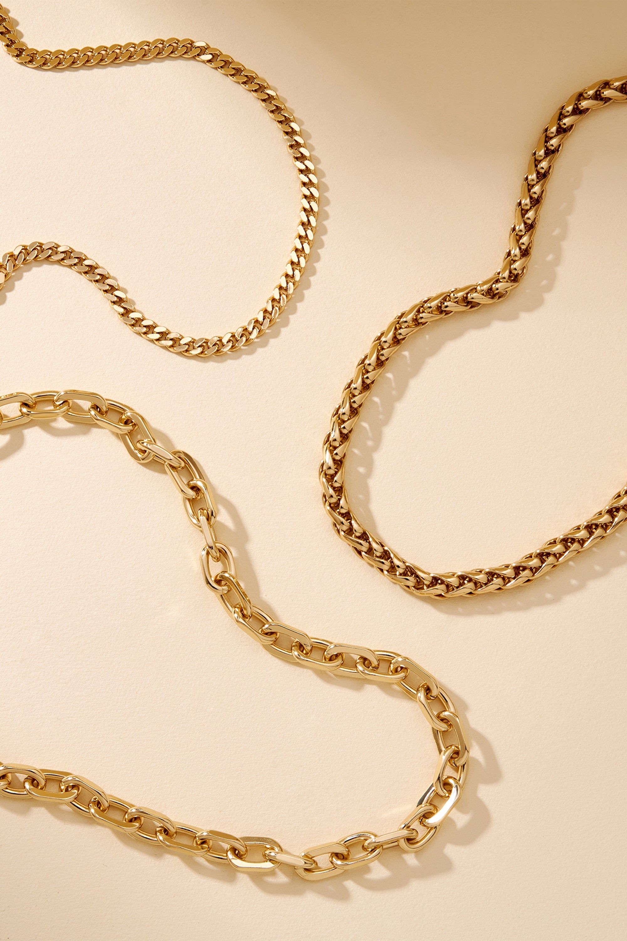 Gold chains from Lennon Necklace collection, sleek and stylish jewelry accessory