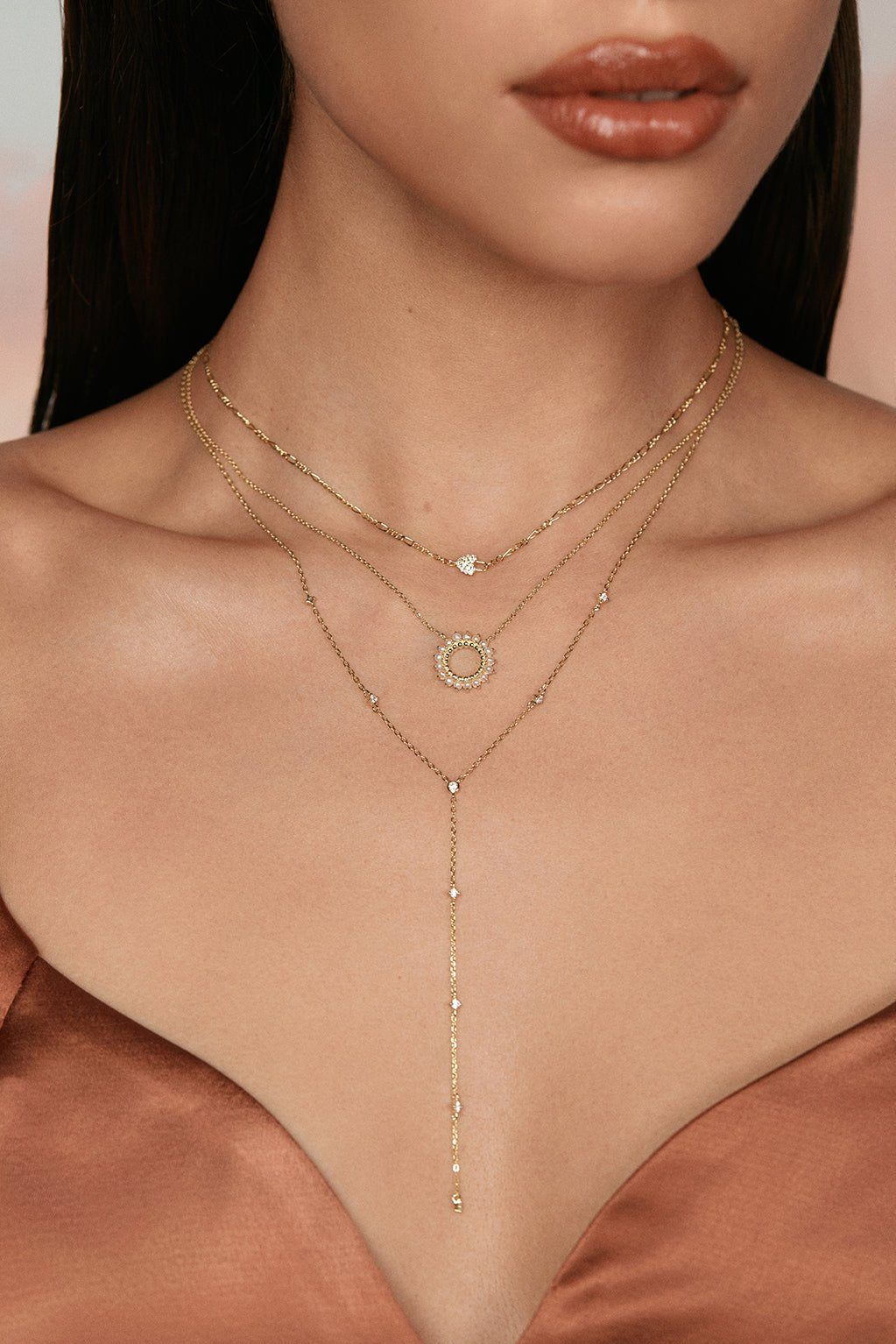 Layered gold necklaces with a stunning open center multi pearl pendant necklace