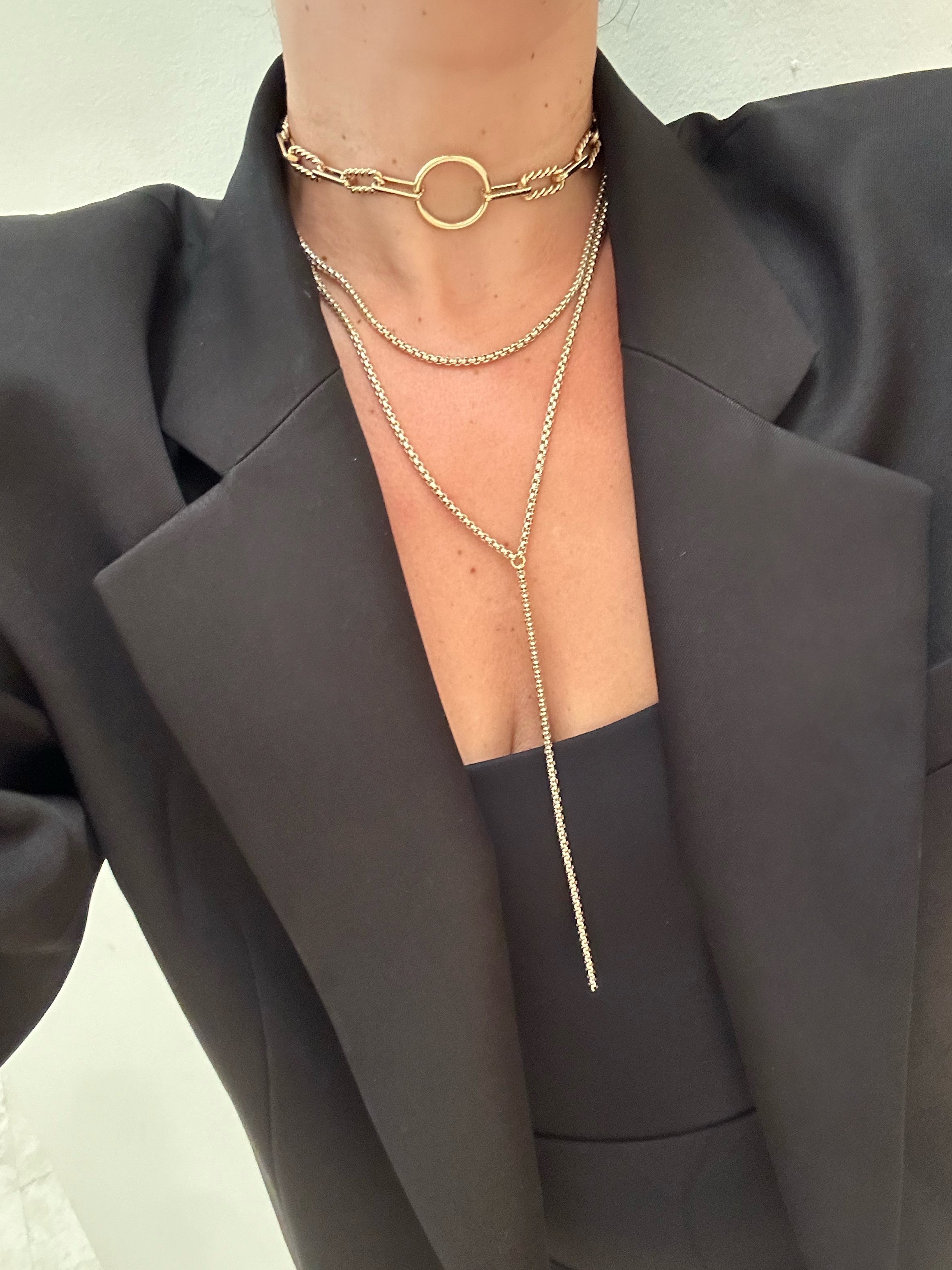 Layered gold necklaces from Thin Luciana Box Chain Lariat collection