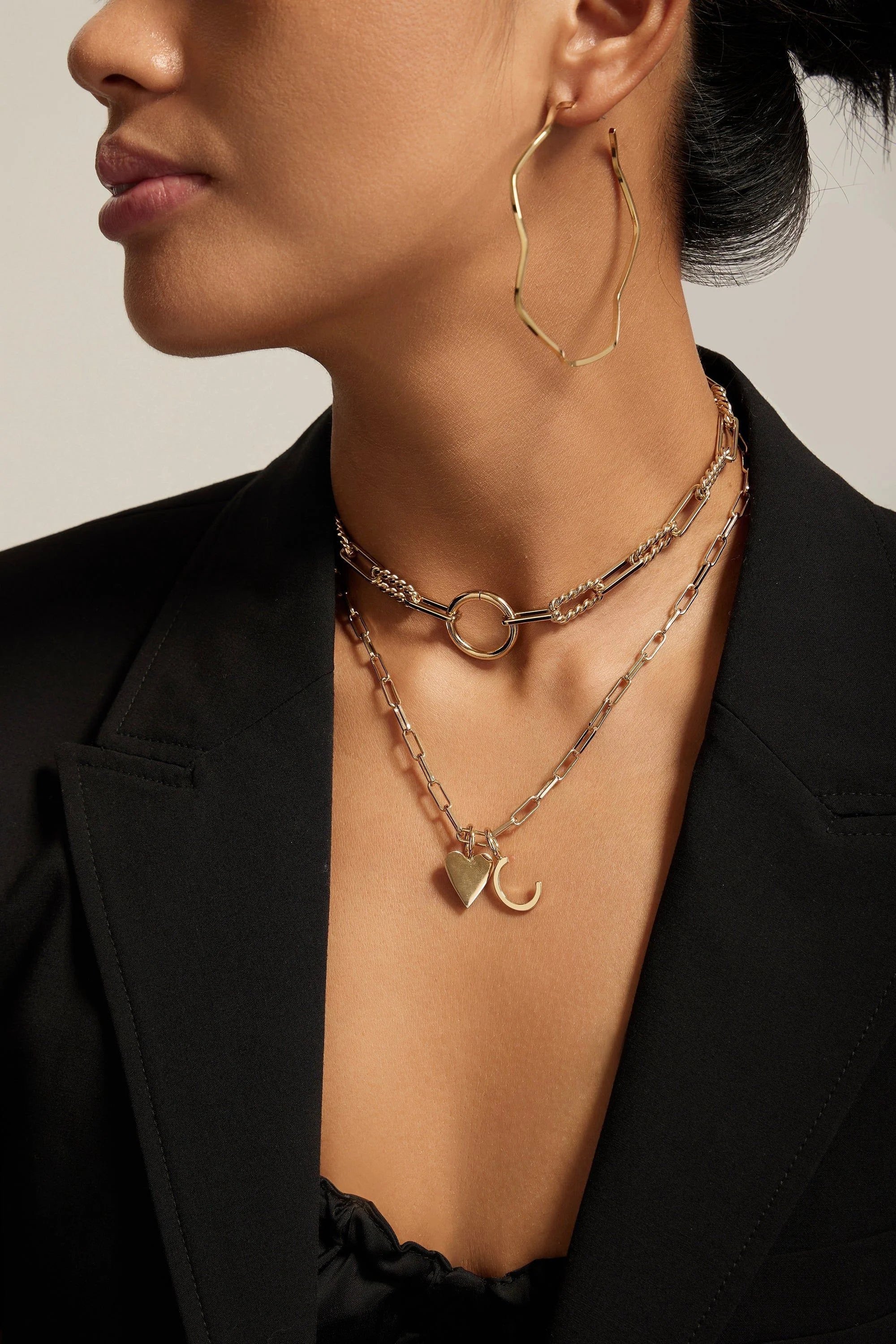 Woman wearing gold jewelry.