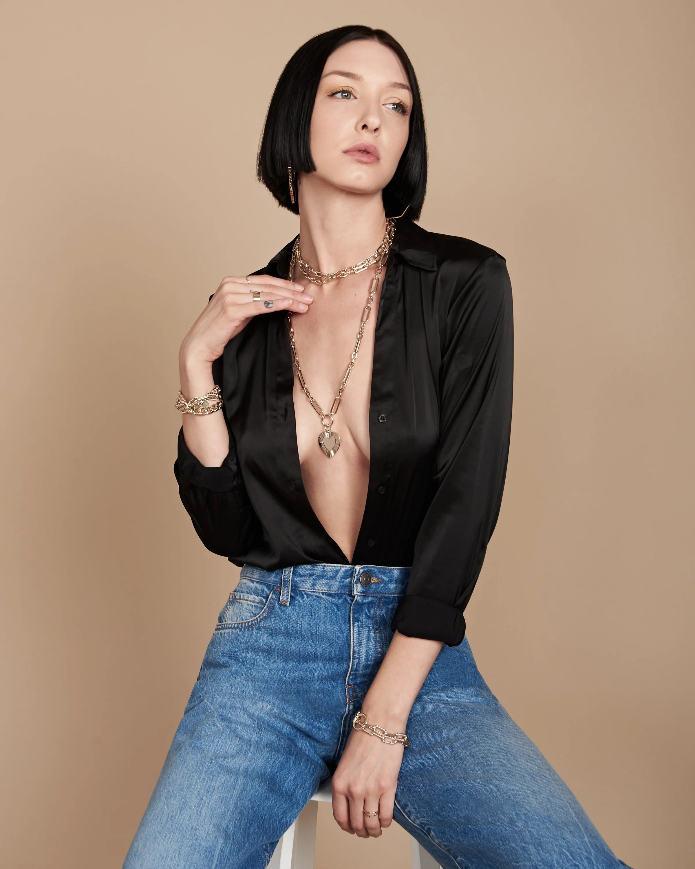 Woman wearing Hildegard Pendant with gold heart measures in brass plated 14k jewelry style