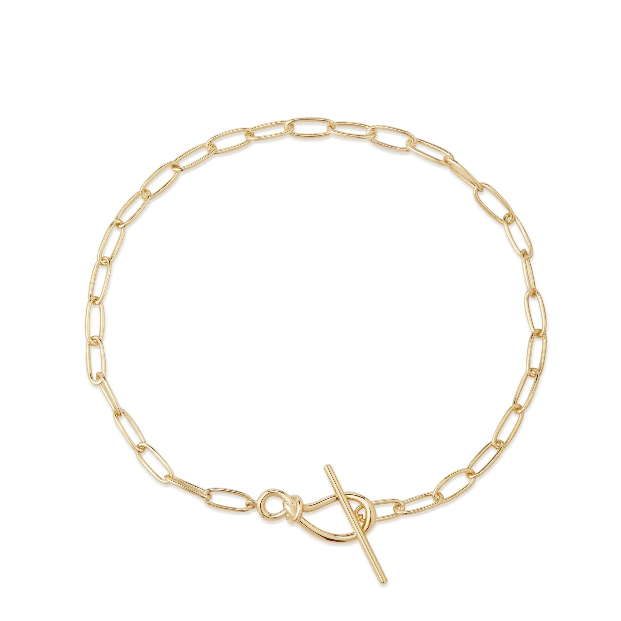 Gold paperclip chain bracelet with knot toggle clasp in sterling silver