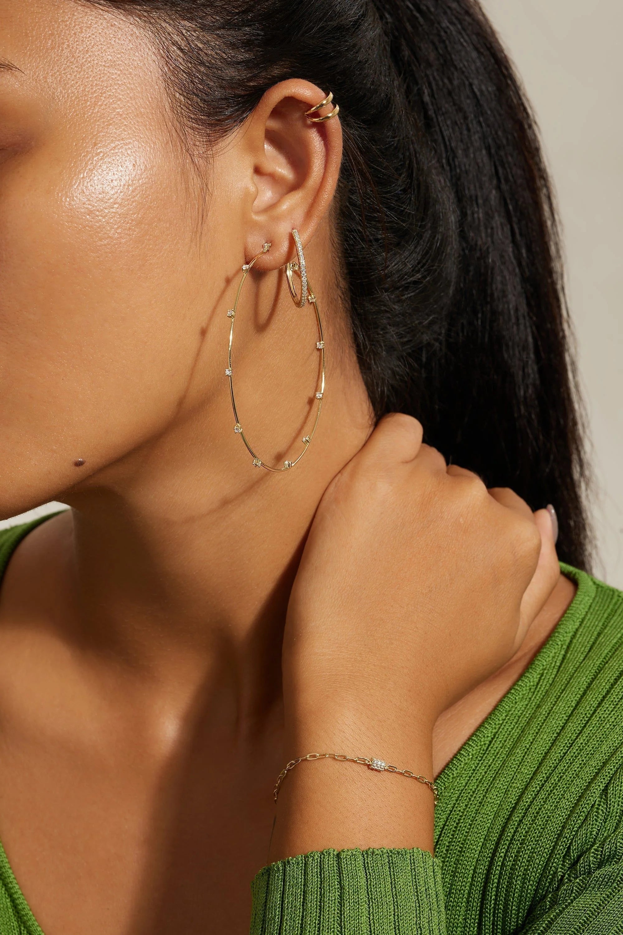 Medium CZ Huggie Hoop Earrings with gold hoops and bracelet for elegant style