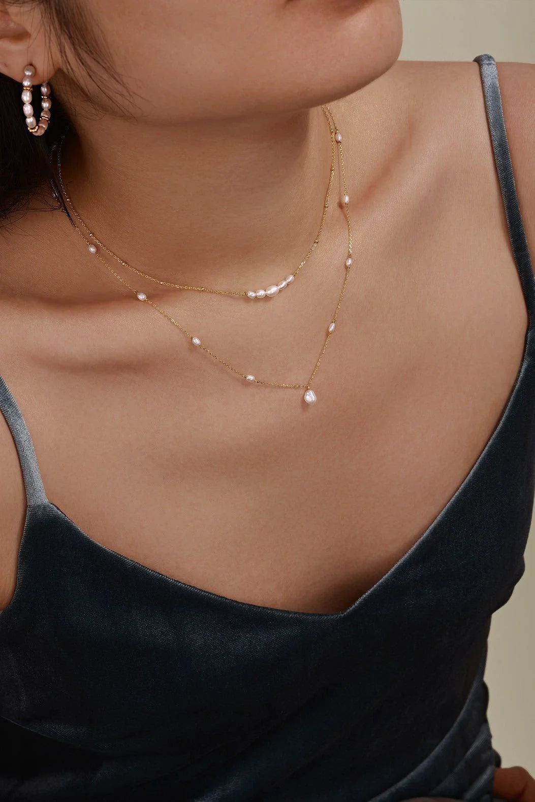 Woman wearing a Micro Clustered Pearl & Bead Necklace with 14k gold vermeil, necklace length 14in+2in