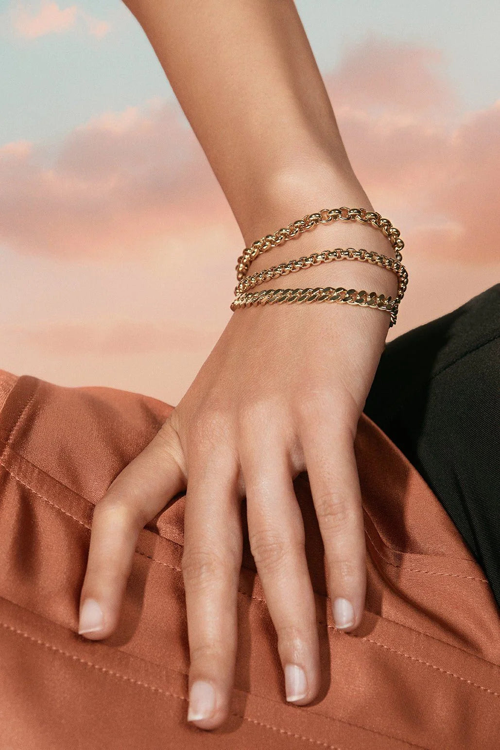 Gold chain bracelets featuring ecoat micro rolo and rhodium plating design