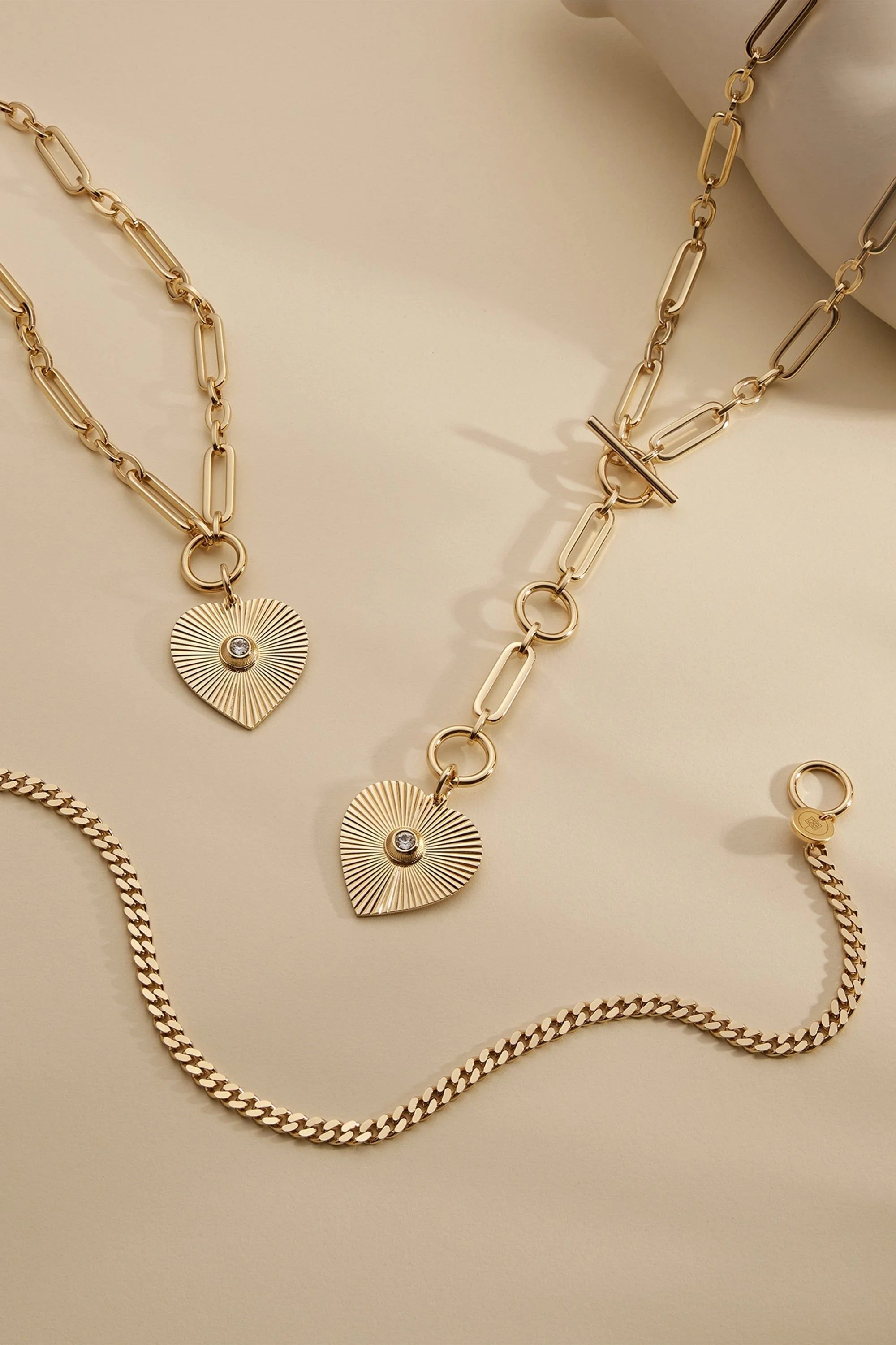 Gold-toned 14k gold plated jewelry set with heart pendants and Swarovski crystal accents