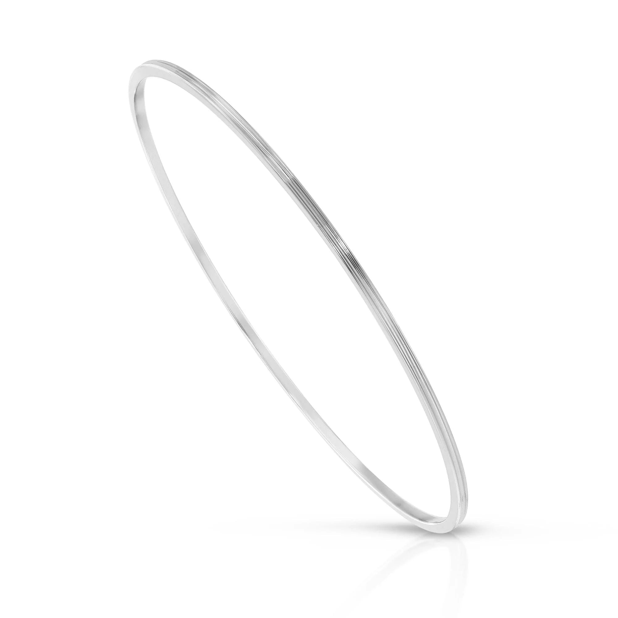 Silver bangle bracelet from Skinny Lily Recycled collection, crafted in Lily Recycled Brass