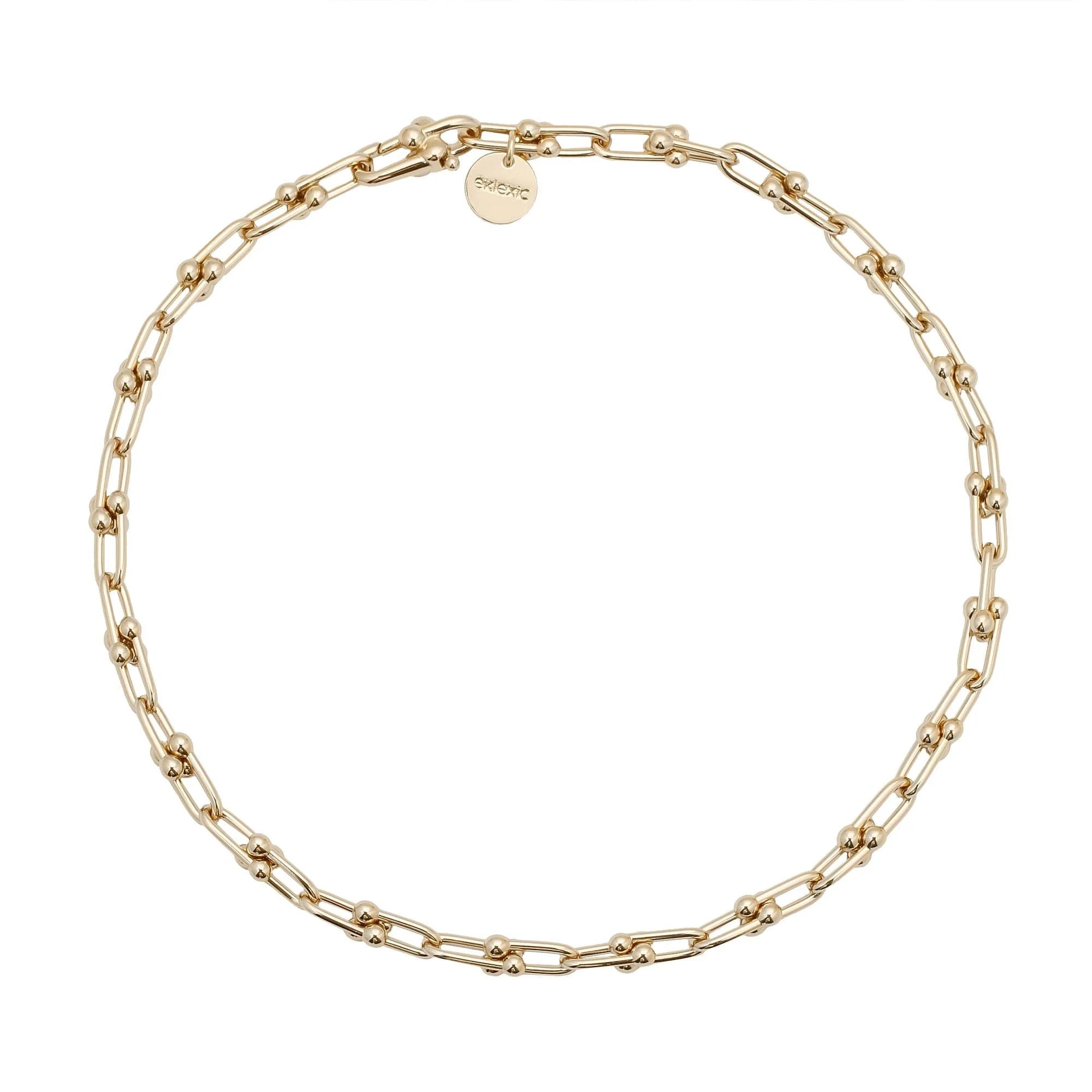 Gold-toned chain link necklace featuring a small Margaux Necklace with custom U link in 14k gold