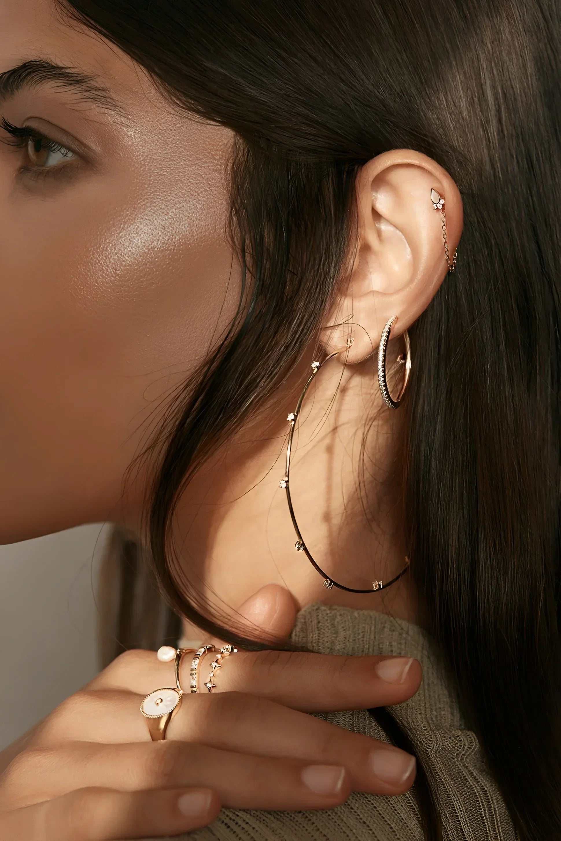Woman wearing a Twinkle CZ Ring in 14k gold showcasing sterling silver jewelry style